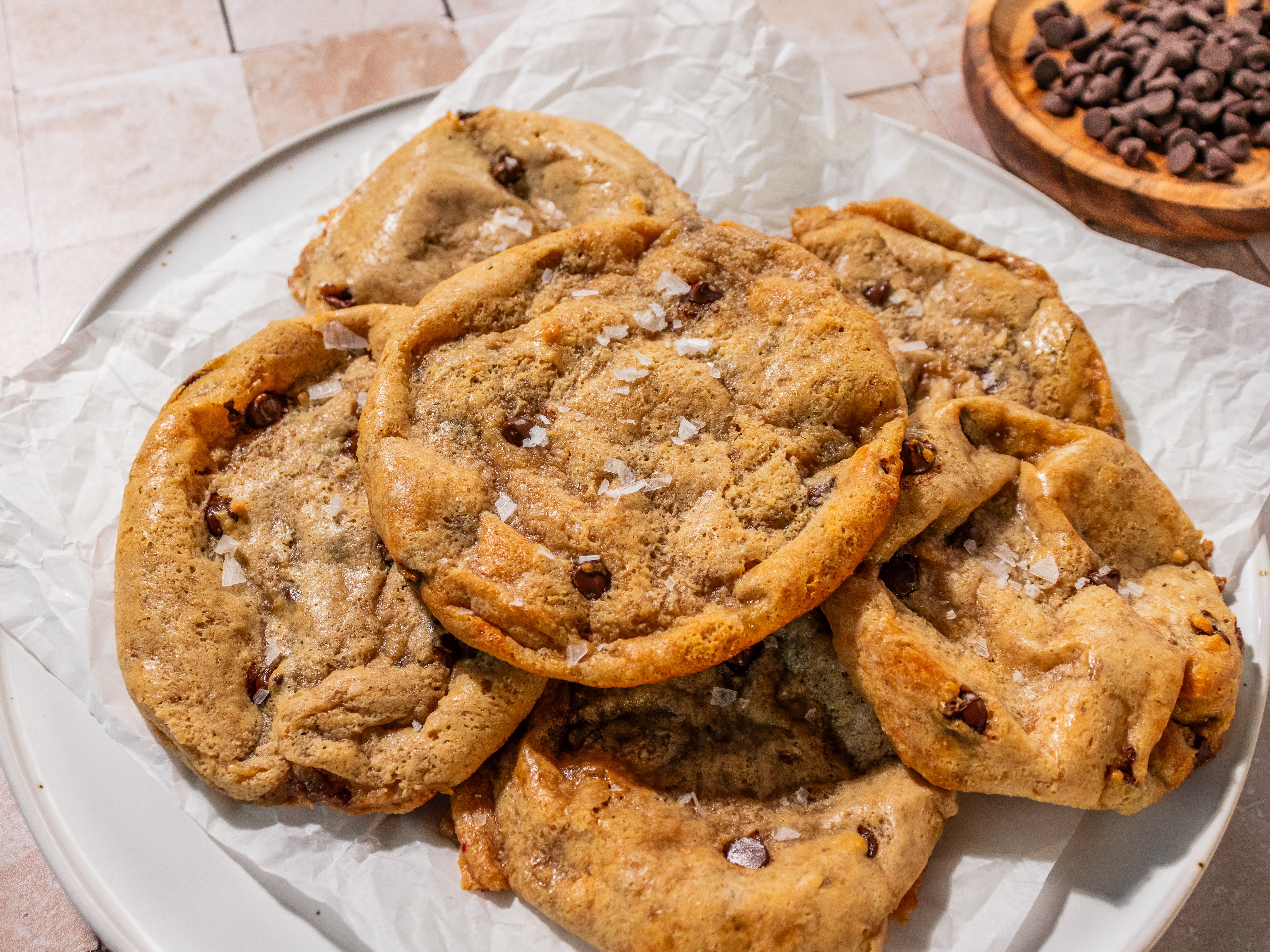 These 4-ingredient mashed banana protein cookies are soft, chewy, chocolatey, and topped with flaky sea salt.