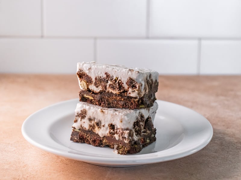 These no-bake Superfood Oreo Cream Bars combine rich chocolate, creamy coconut, and collagen protein for a satisfying treat.